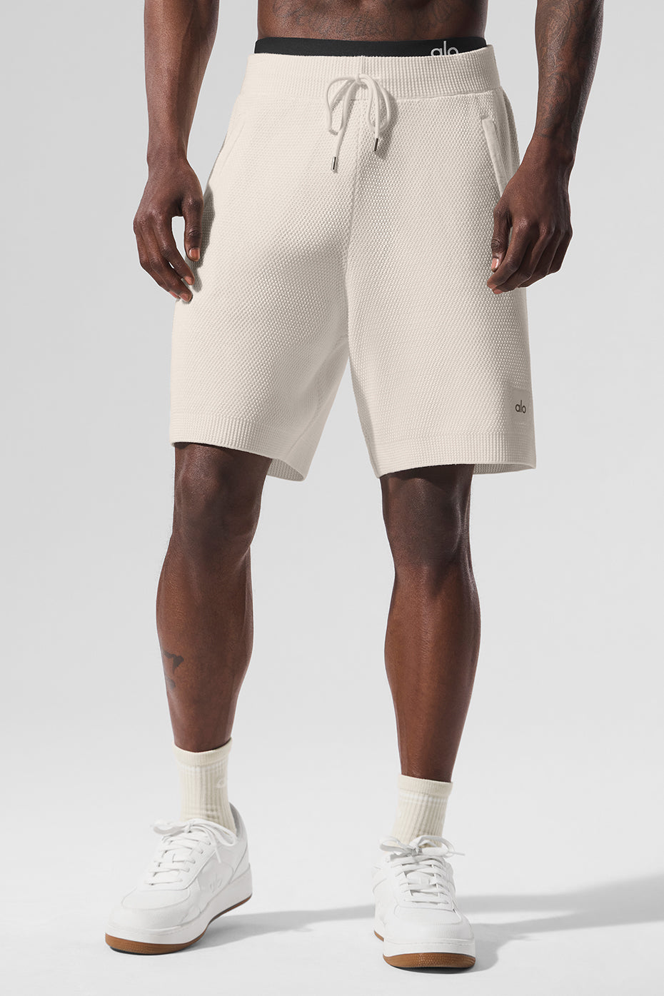 Close-up of ivory sweater shorts made from soft cotton knit fabric