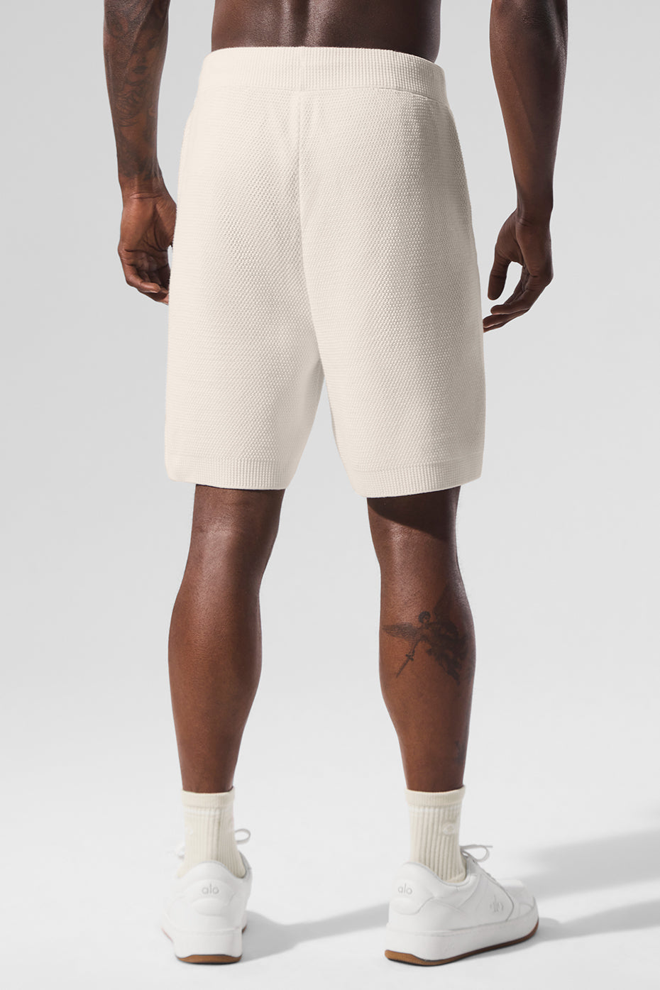 Close-up of ivory sweater shorts made from soft cotton knit fabric