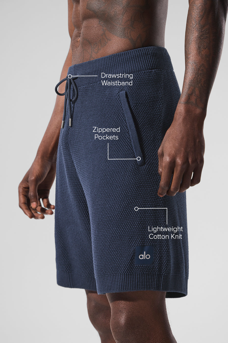 Side view showcasing the lightweight material of navy sports shorts.