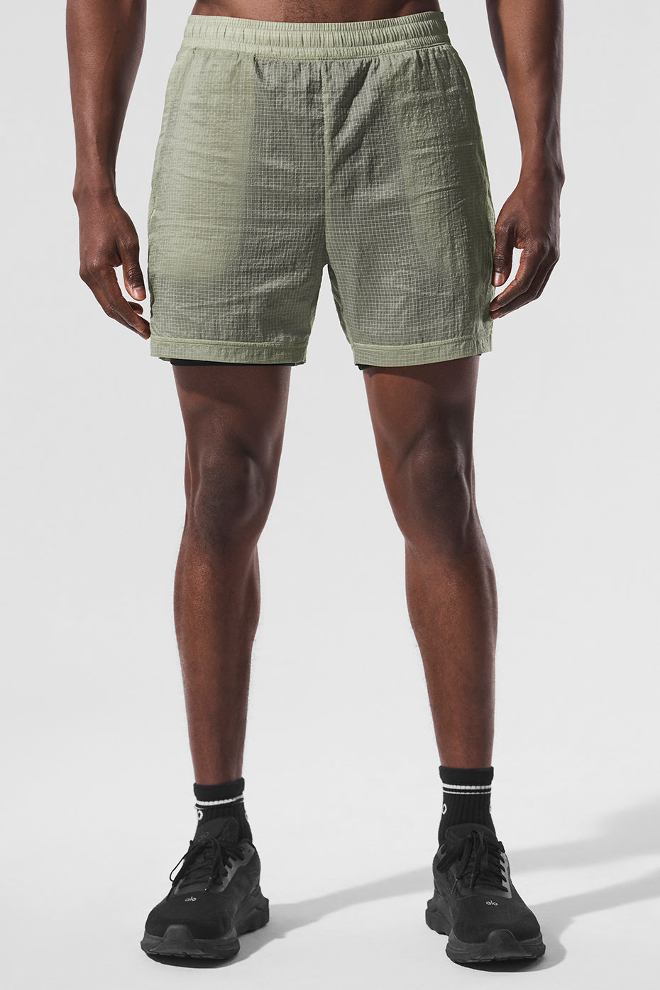 Front view of Game Time 2-in-1 compression running shorts in limestone and black.