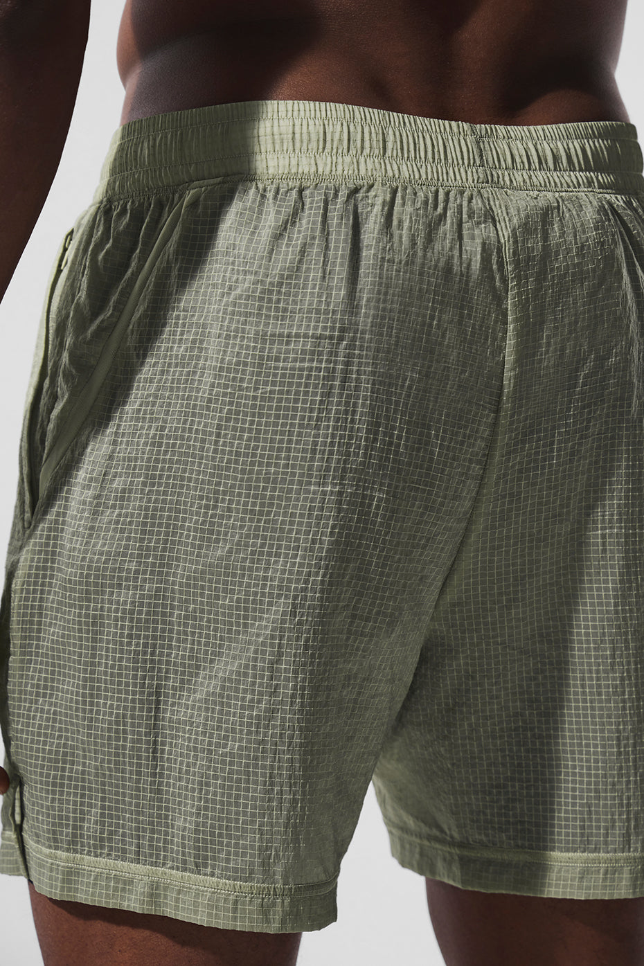 Front view of Game Time 2-in-1 compression running shorts in limestone and black.