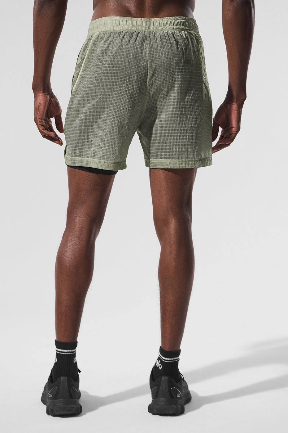 Back view highlighting the zippered pockets of the Game Time 2-in-1 shorts.