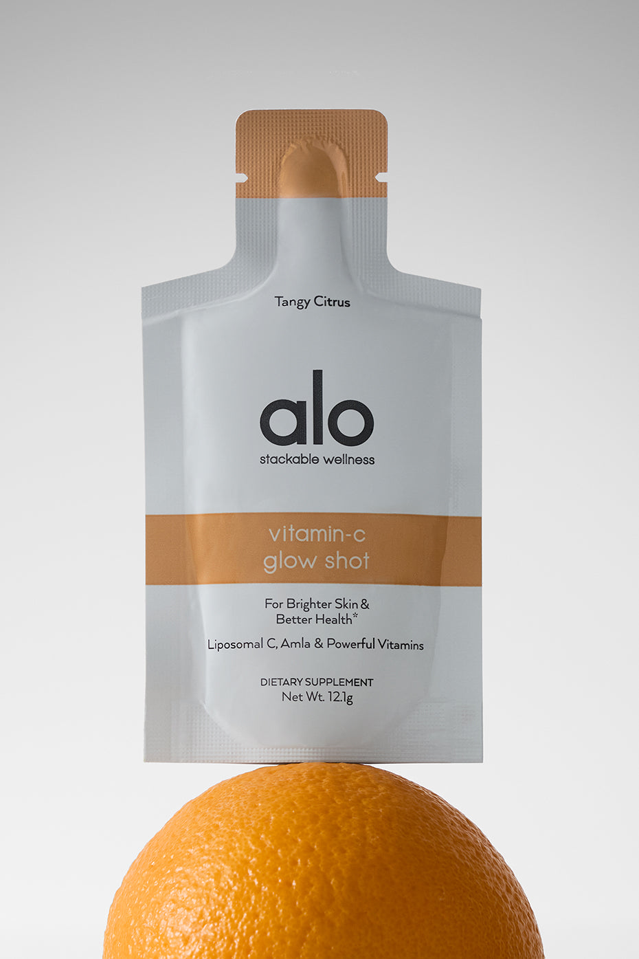 Radiance Boost Liposomal Vitamin C Shot in a sachet on a countertop.