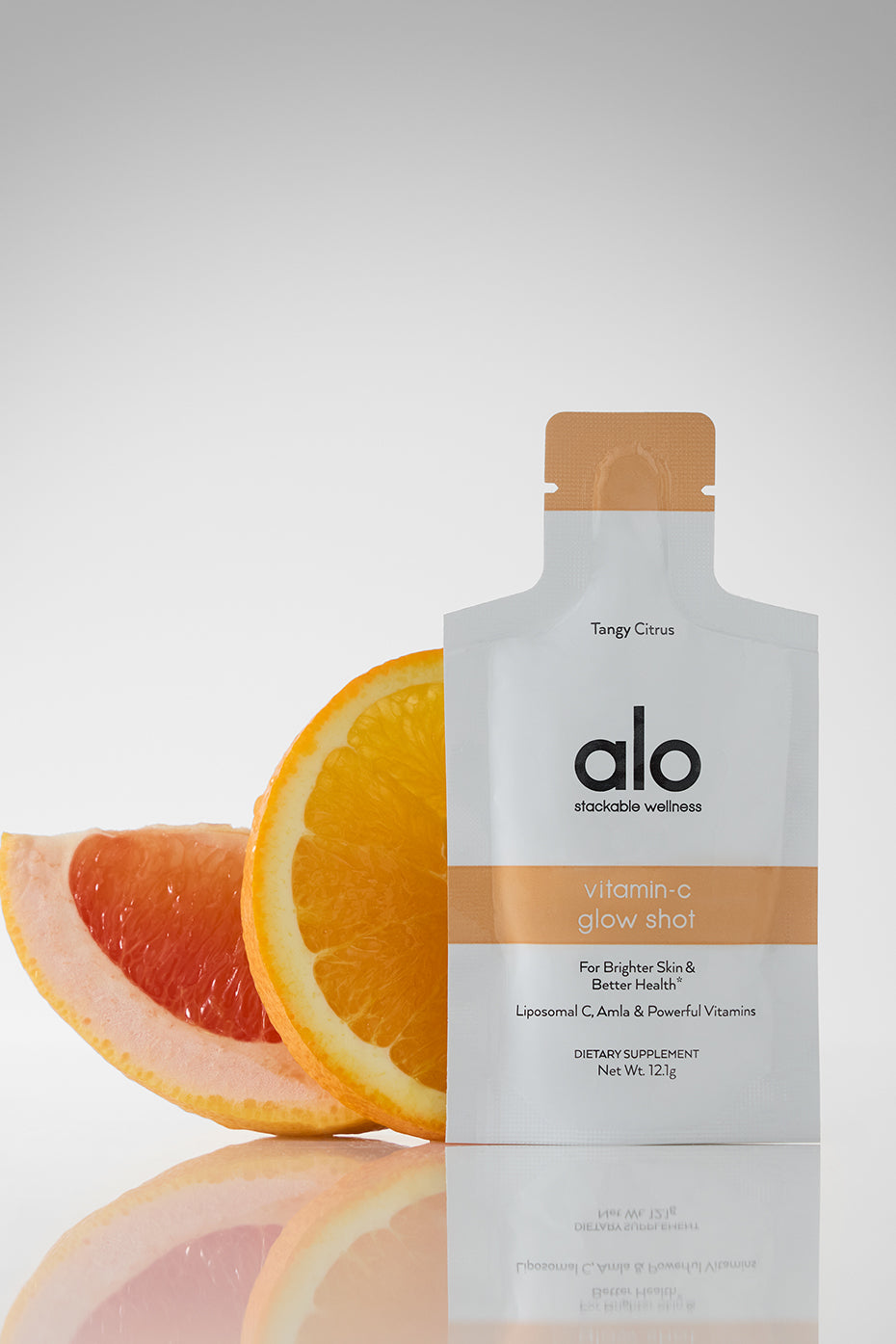 Lifestyle shot of a person enjoying Radiance Boost Liposomal Vitamin C Shot outdoors.