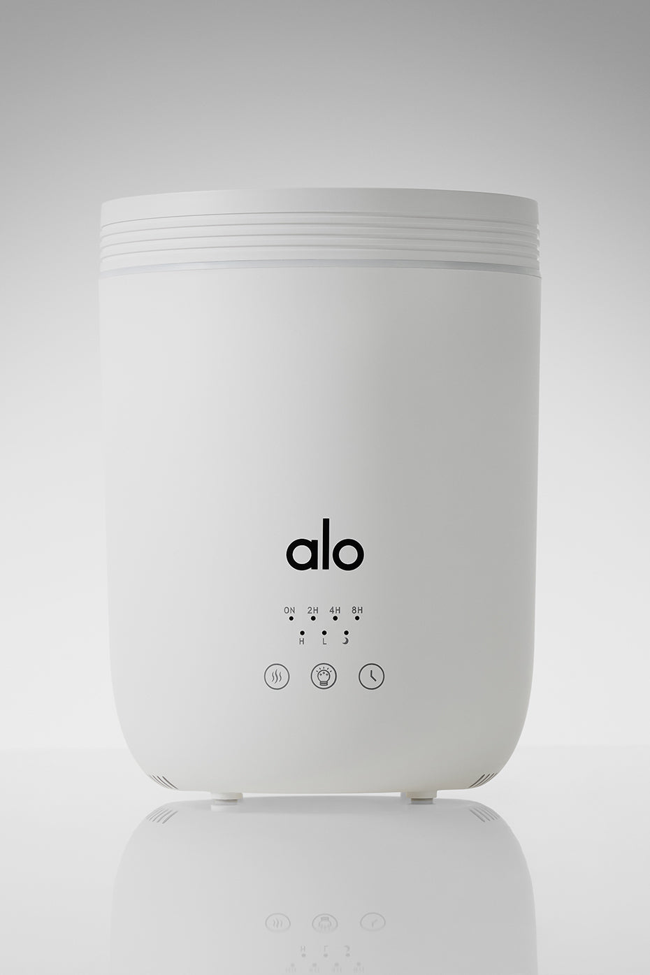 White Aura diffuser with mist coming out, ideal for home aromatherapy