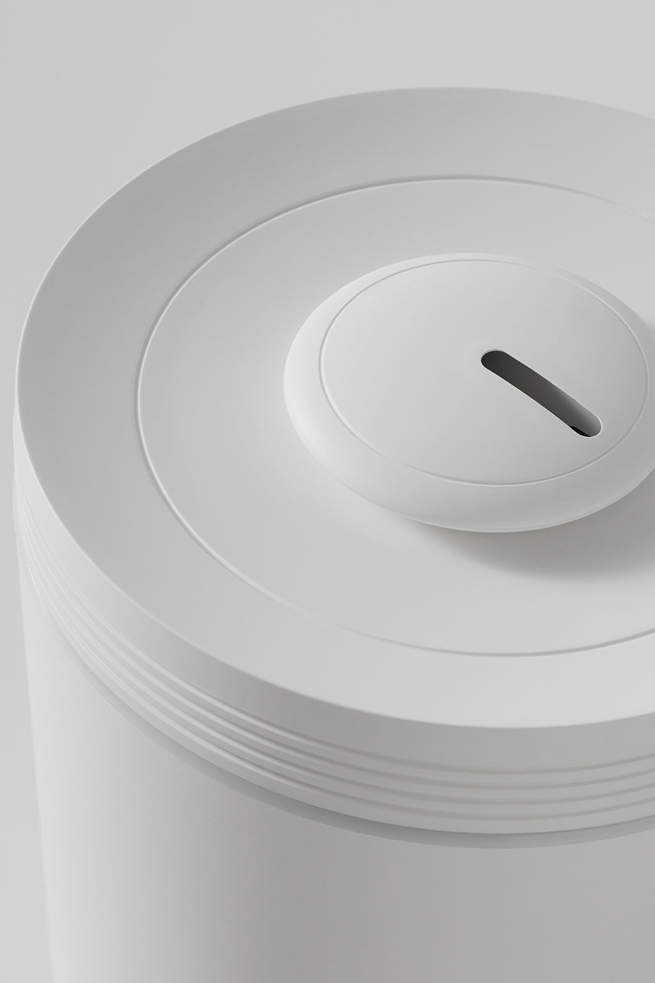 Modern diffuser in a serene yoga space with essential oils nearby