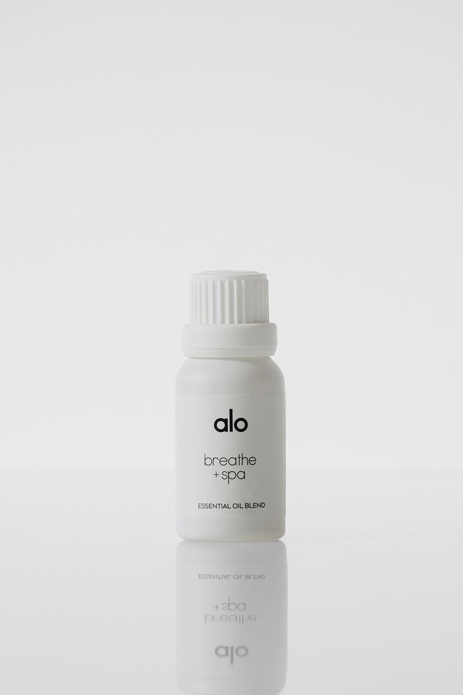 Essential oil bottle featuring ravintsara and tea tree, ideal for spa use.