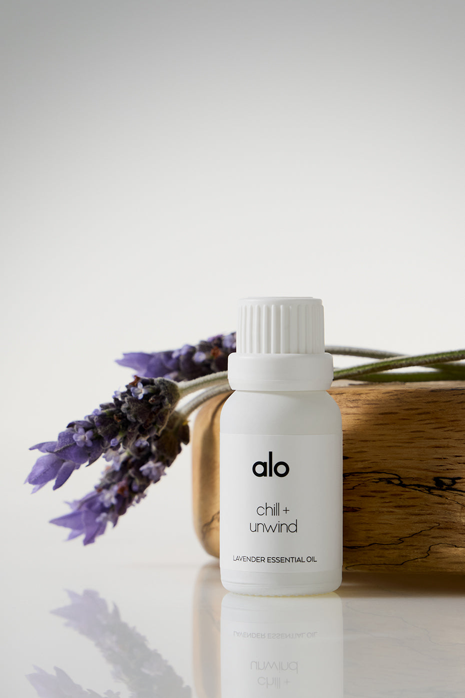 Pure lavender essential oil bottle with lavender sprigs