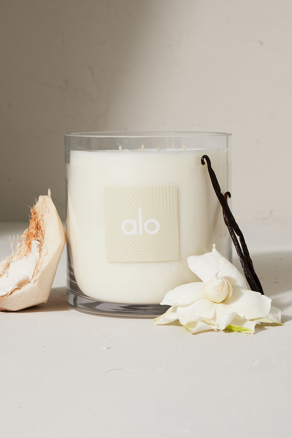 Close-up of ALO Love Candle with floral scent oil and crackling wood wick