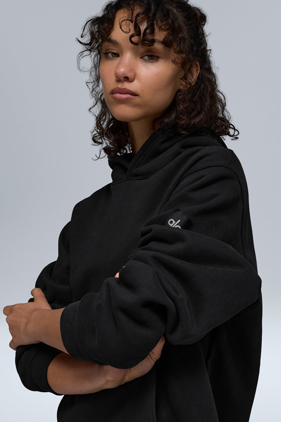 Back view of unisex hoodie in black, designed for comfort and style.