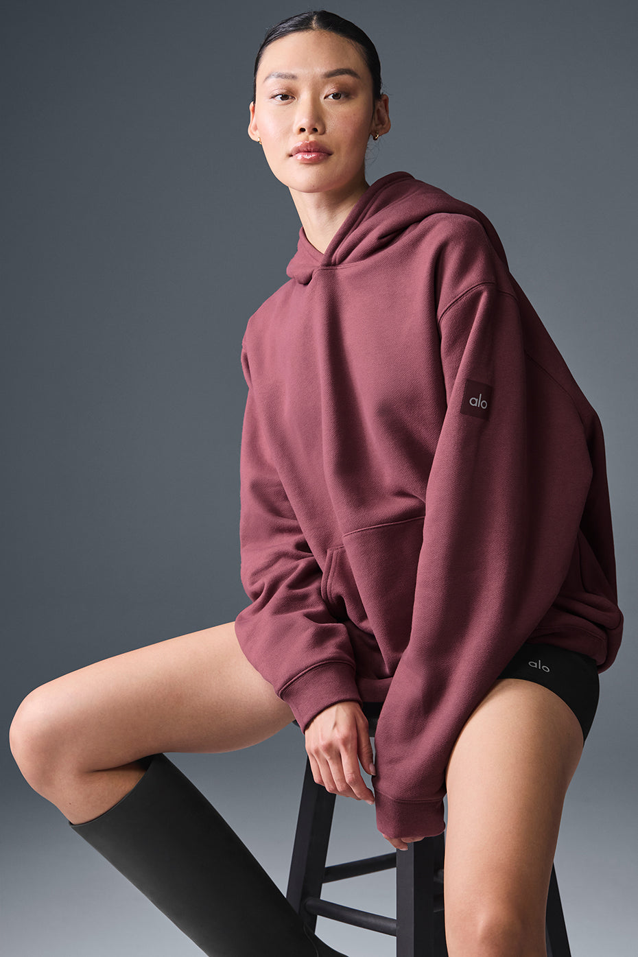 Unisex oversized hoodie laid flat to showcase design details.
