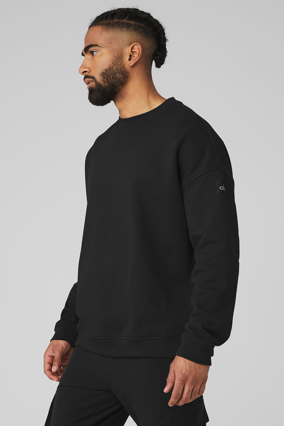 Side view showcasing the relaxed fit of the oversized cotton sweater.