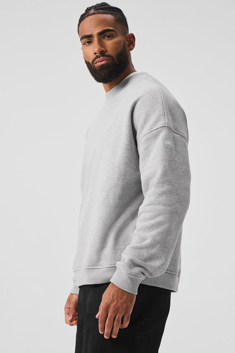 Back view displaying the relaxed fit of the unisex pullover in a casual setting.