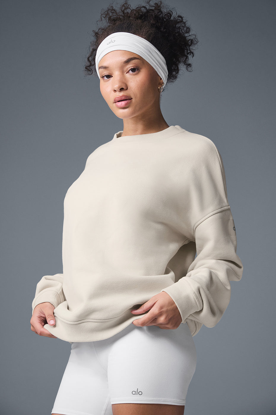 Front view of heavyweight crew neck pullover in bone color, showcasing oversized fit and dropped shoulders