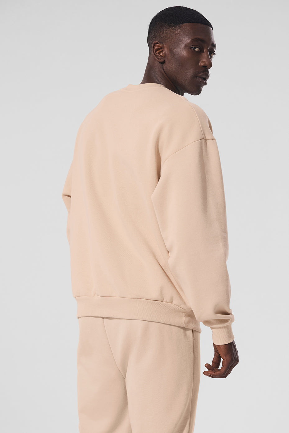Close-up of the ribbed cuffs and soft fleece interior of the French terry sweatshirt