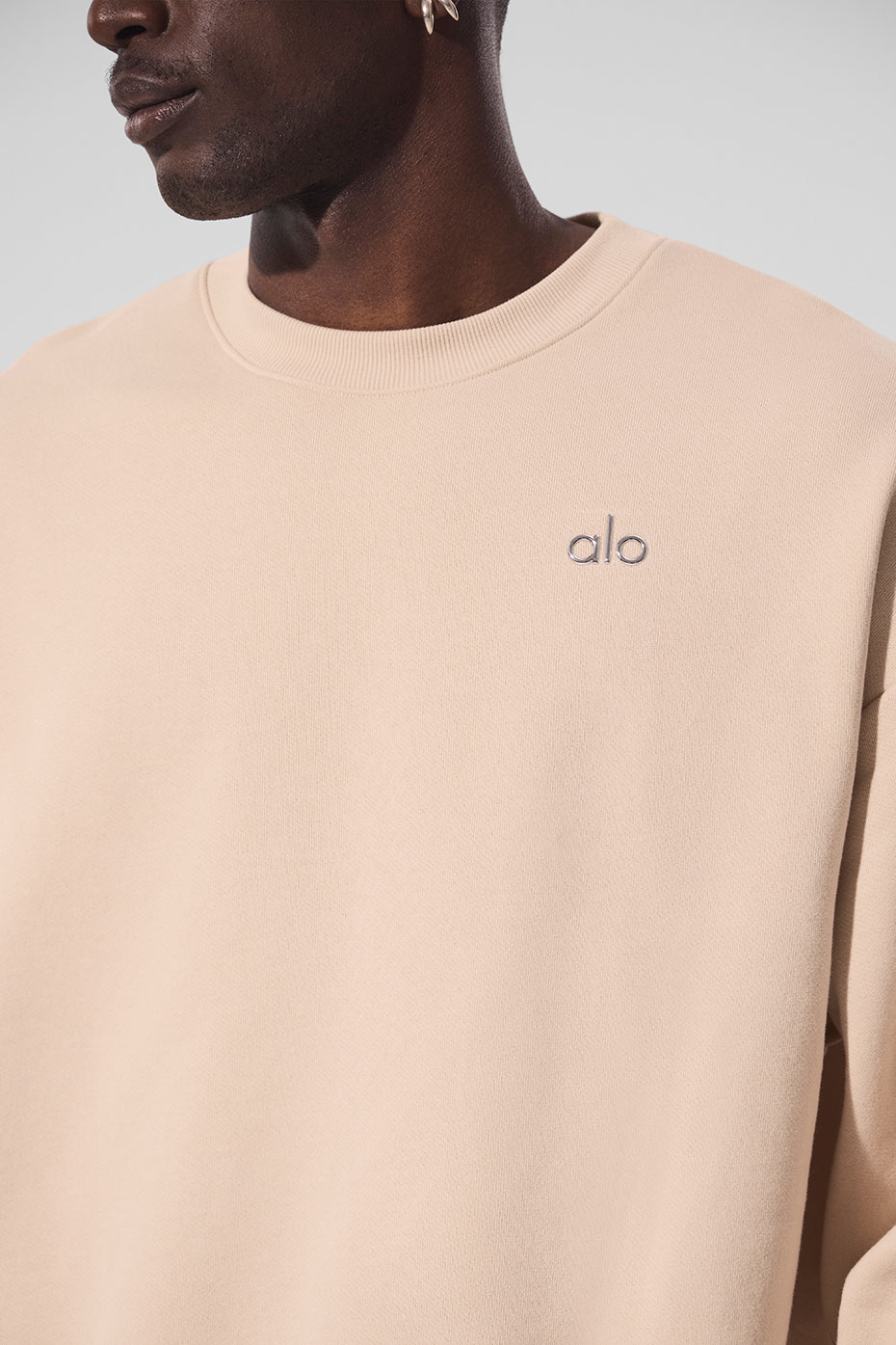 Model wearing the French terry pullover crewneck, styled for streetwear