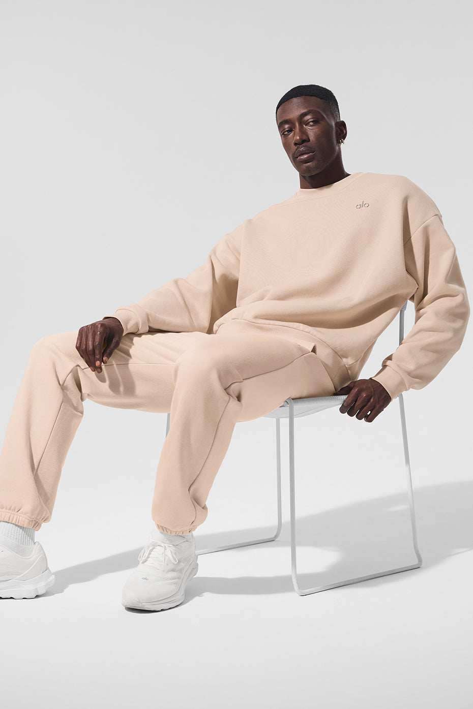 Model wearing the French terry pullover crewneck, styled for streetwear