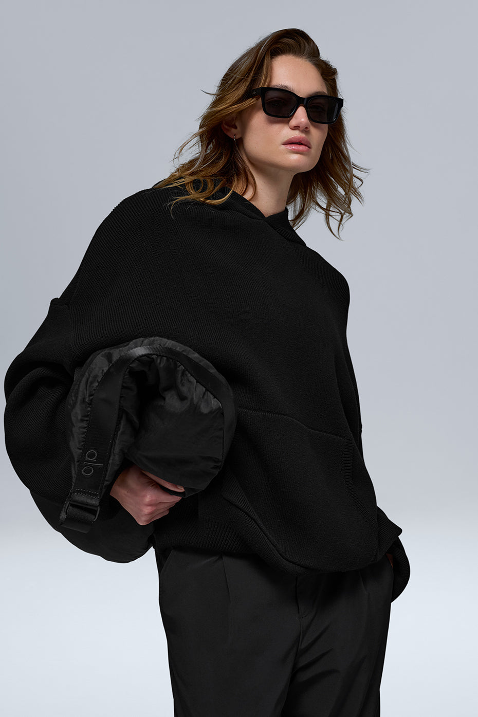 Front view of the Scholar Comfort Hoodie in black, showcasing the kangaroo pocket.
