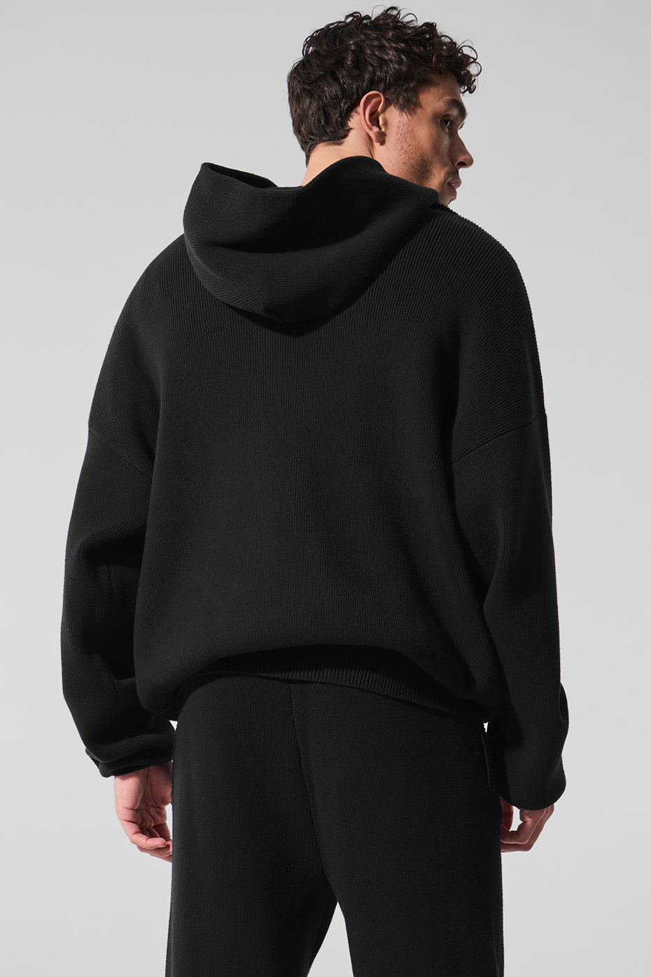 Model wearing the cozy hoodie paired with casual jeans and sneakers