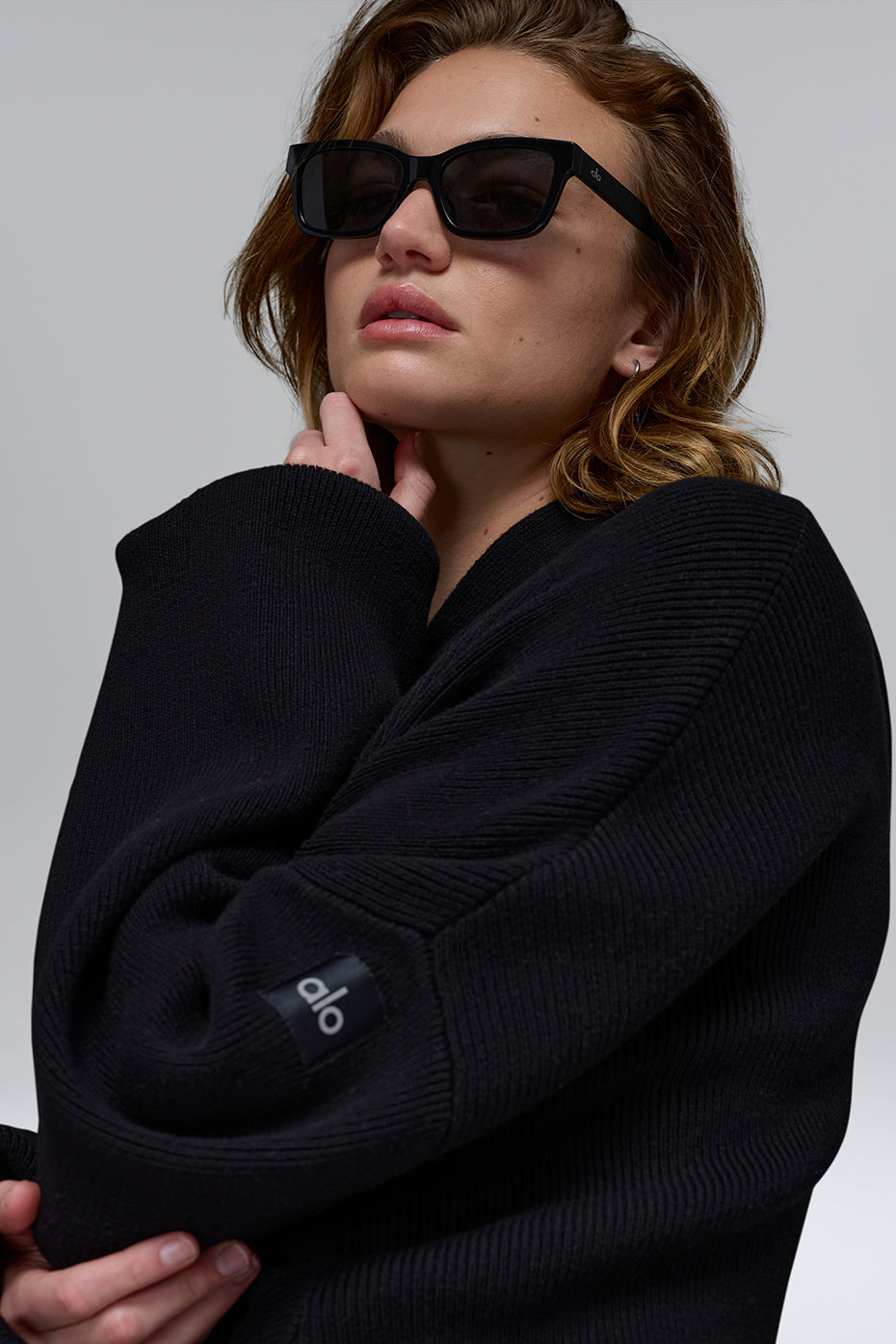 Side view of the Scholar Comfort Hoodie, highlighting the ribbed cuffs.