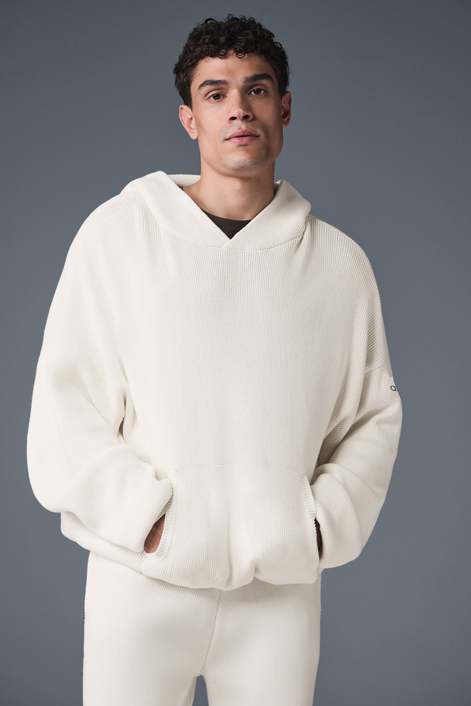Front view of the ivory cotton hoodie with kangaroo pocket and hood