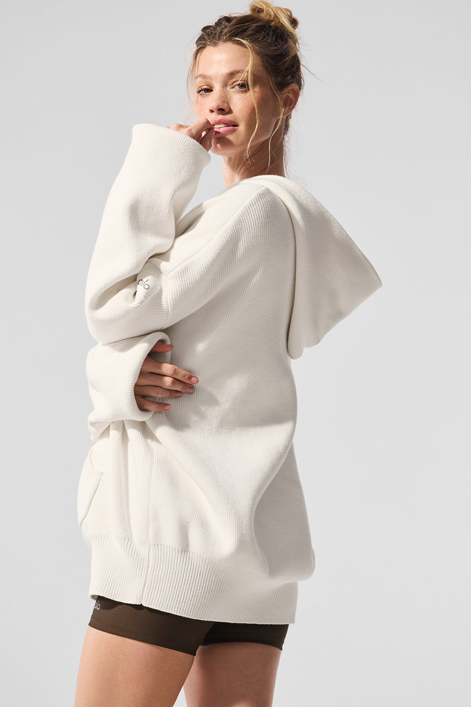 Front view of the hoodie highlighting the kangaroo pocket and ribbed cuffs