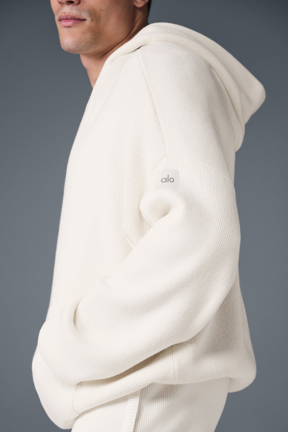 Front view of the ivory cotton hoodie with kangaroo pocket and hood
