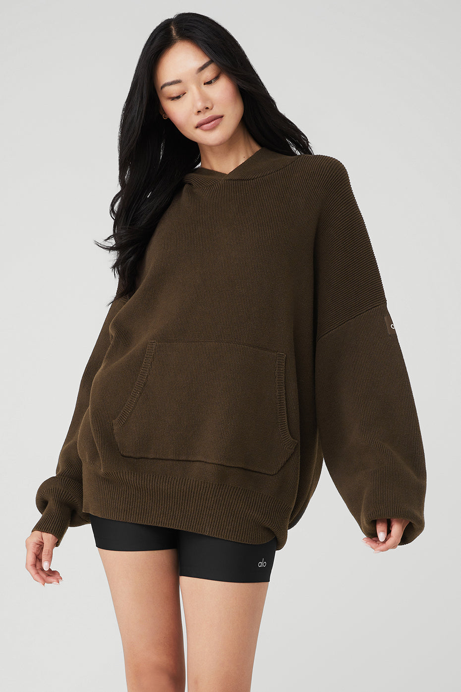 Front view of the Scholar cozy hoodie in espresso color, showcasing the kangaroo pocket.