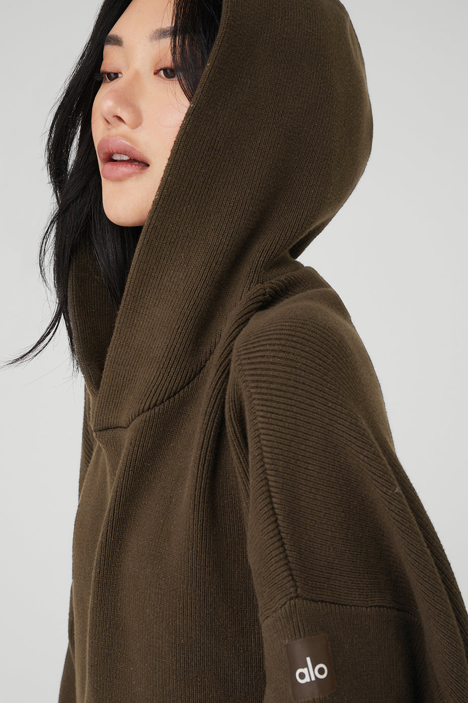Front view of the Scholar cozy hoodie in espresso color, showcasing the kangaroo pocket.