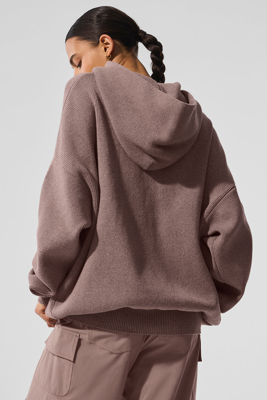 Close-up of the kangaroo pocket on the mens hooded pullover sweater.