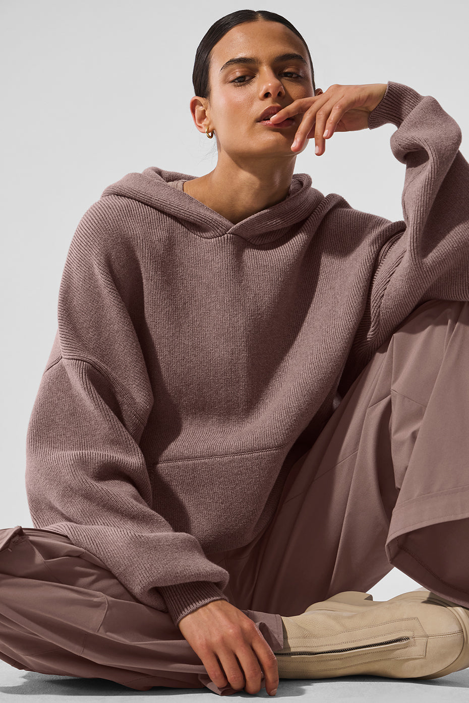 Close-up of the kangaroo pocket on the mens hooded pullover sweater.