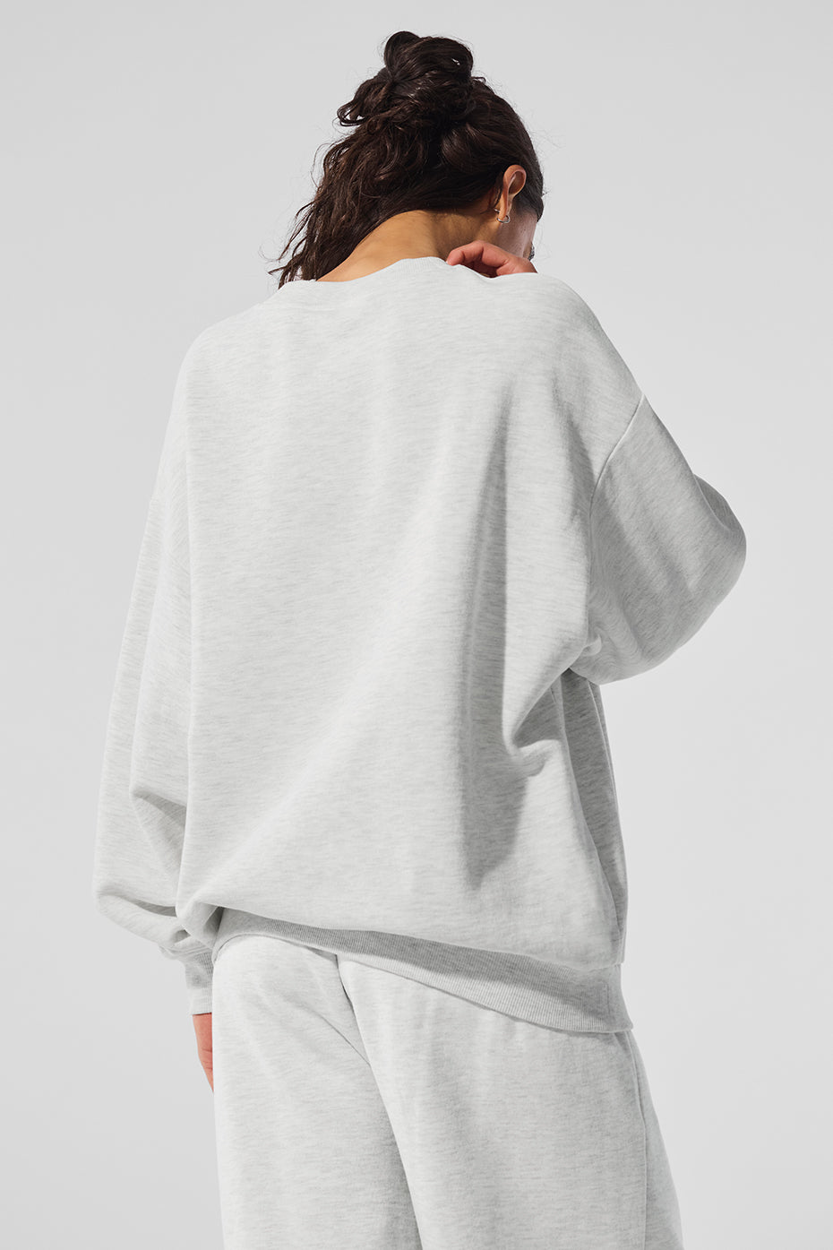 Front view of the white Heather crew neck sweatshirt highlighting the classic design and logo