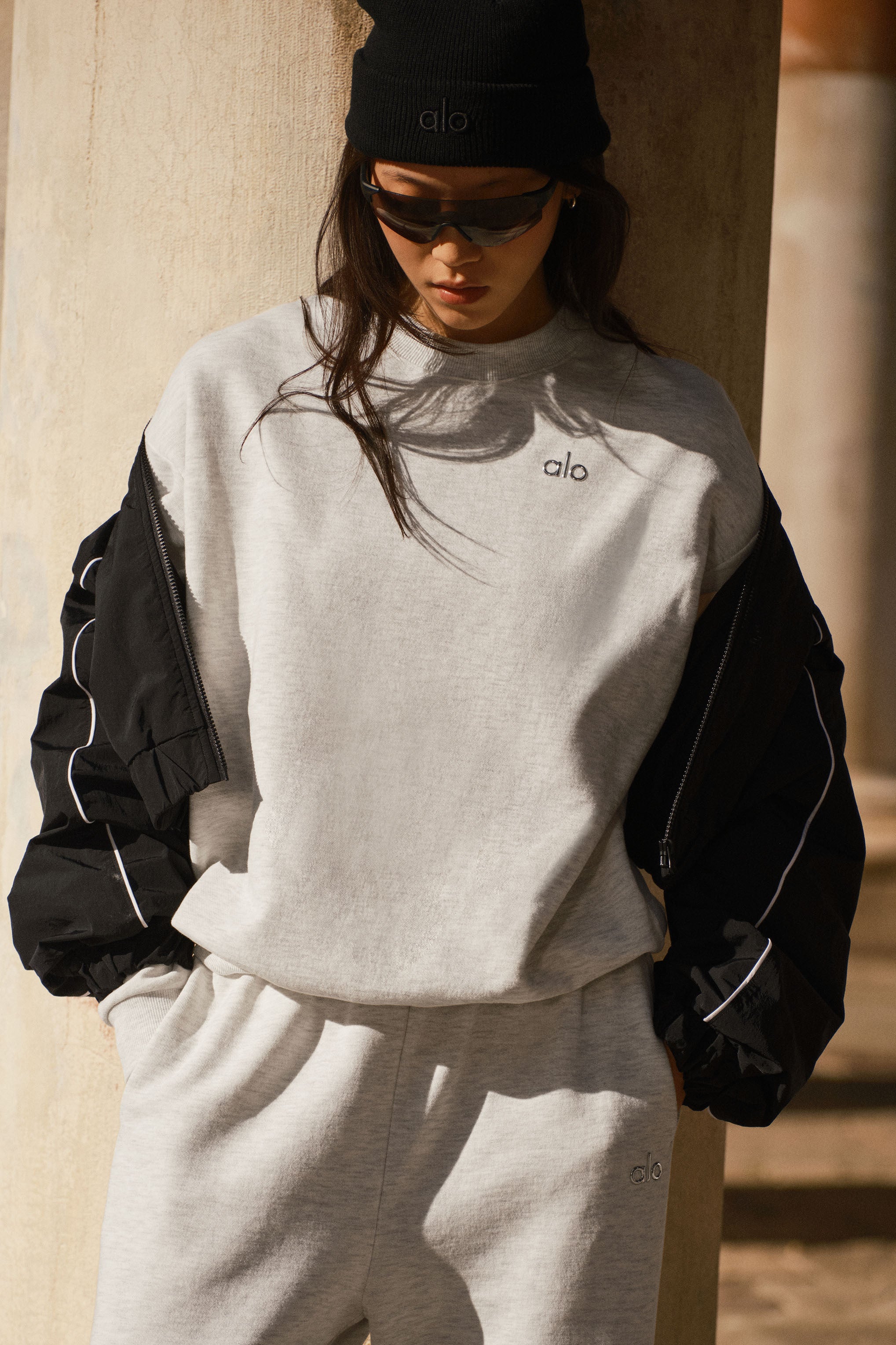 Front view of the white Heather crew neck sweatshirt highlighting the classic design and logo