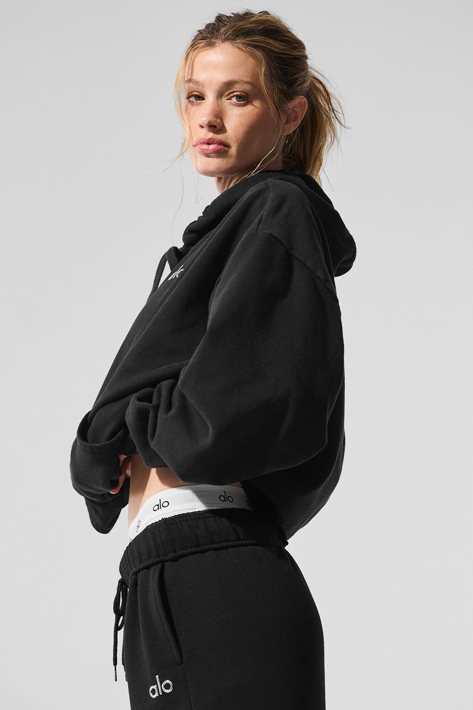 Accolade hoodie layered under a jacket for cooler weather