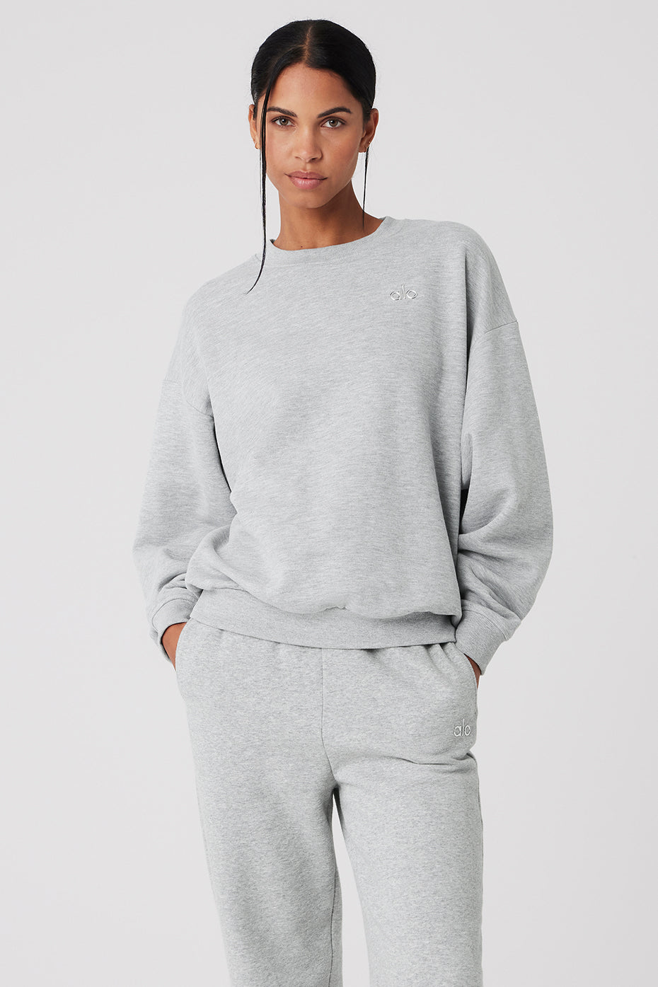 Accolade crew neck pullover in Athletic Heather Grey, styled with sweatpants.