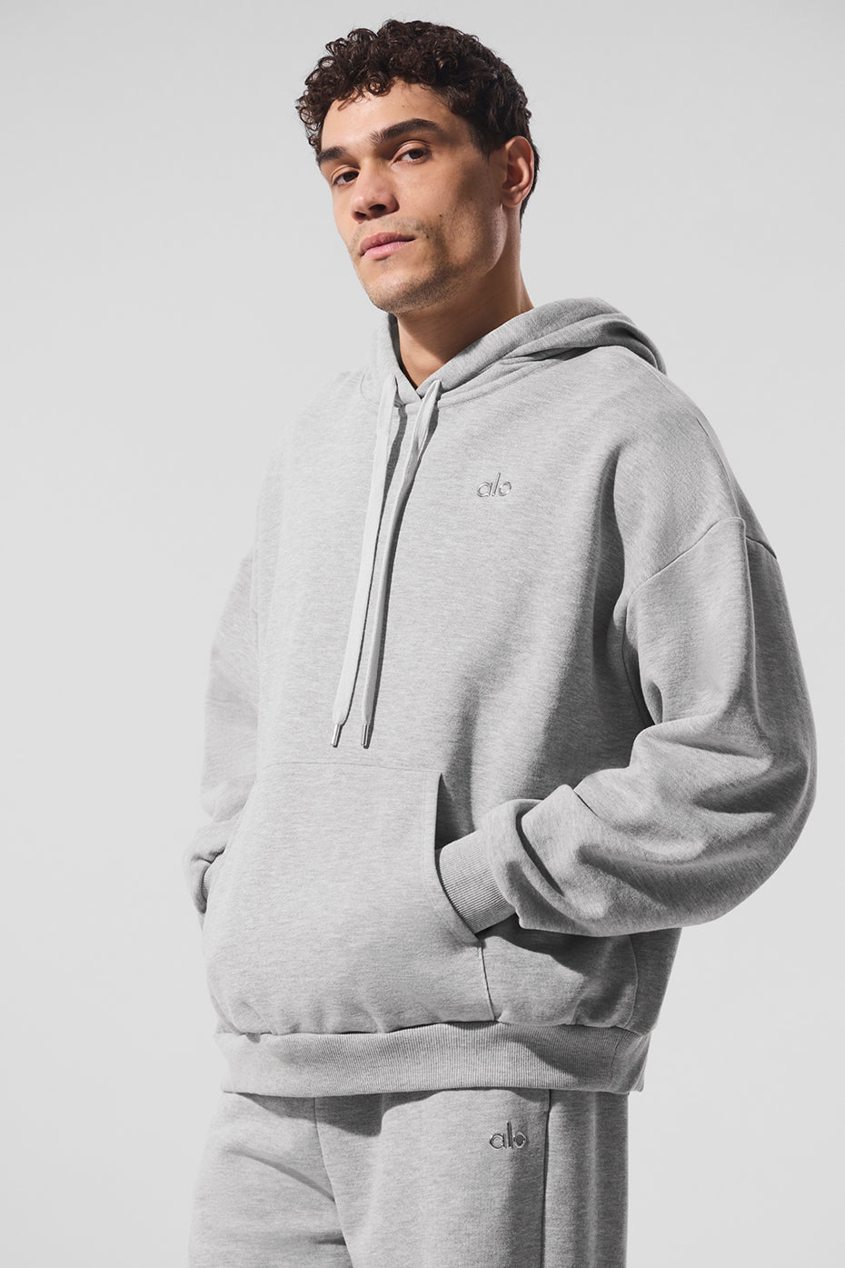 Front view of the comfort hoodie styled with joggers for casual city strolls