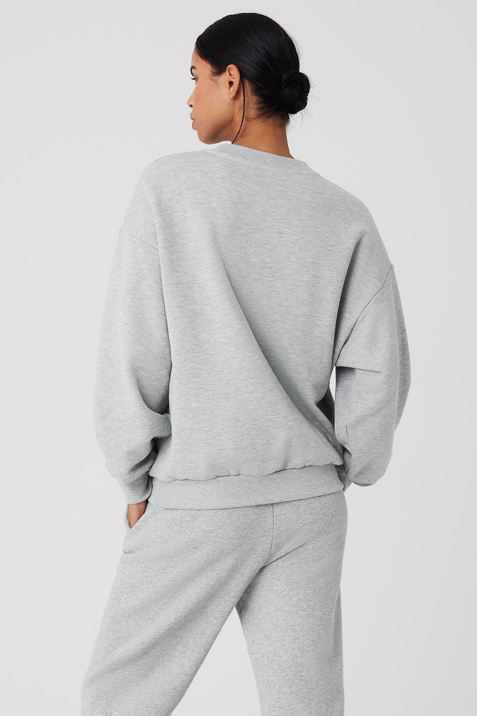 Model wearing the Accolade crew neck pullover, showcasing its relaxed fit.