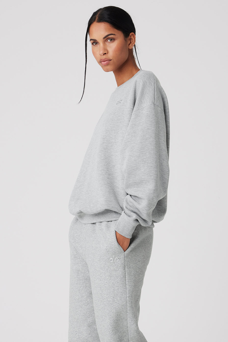 Accolade crew neck pullover in Athletic Heather Grey, styled with sweatpants.