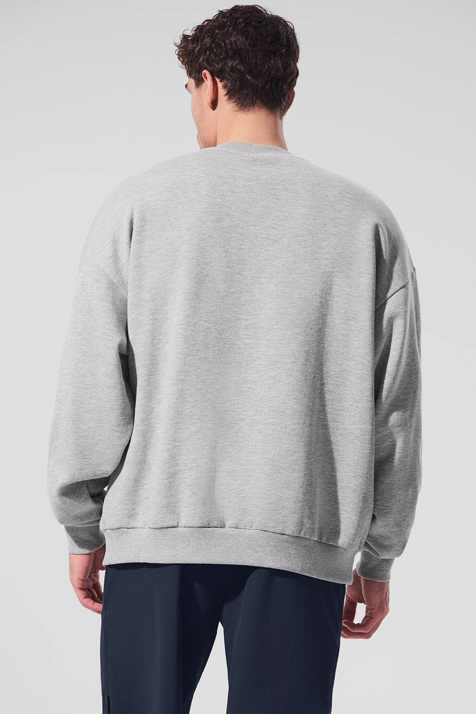Front view of crew neck pullover styled with joggers—best for casual weekday wear.