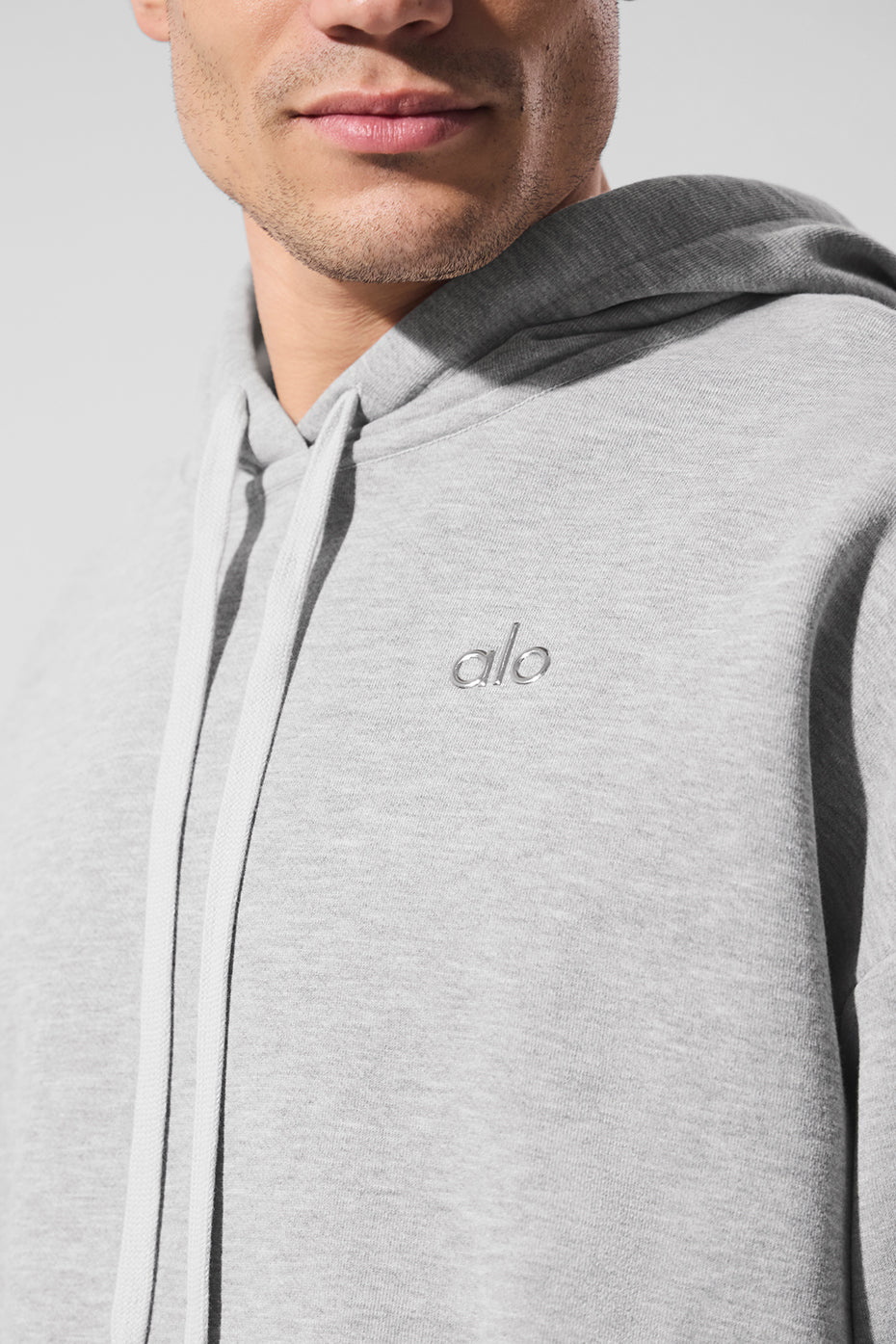 Laid-back pose showing the ss activewear hoodie in action during a warm-up