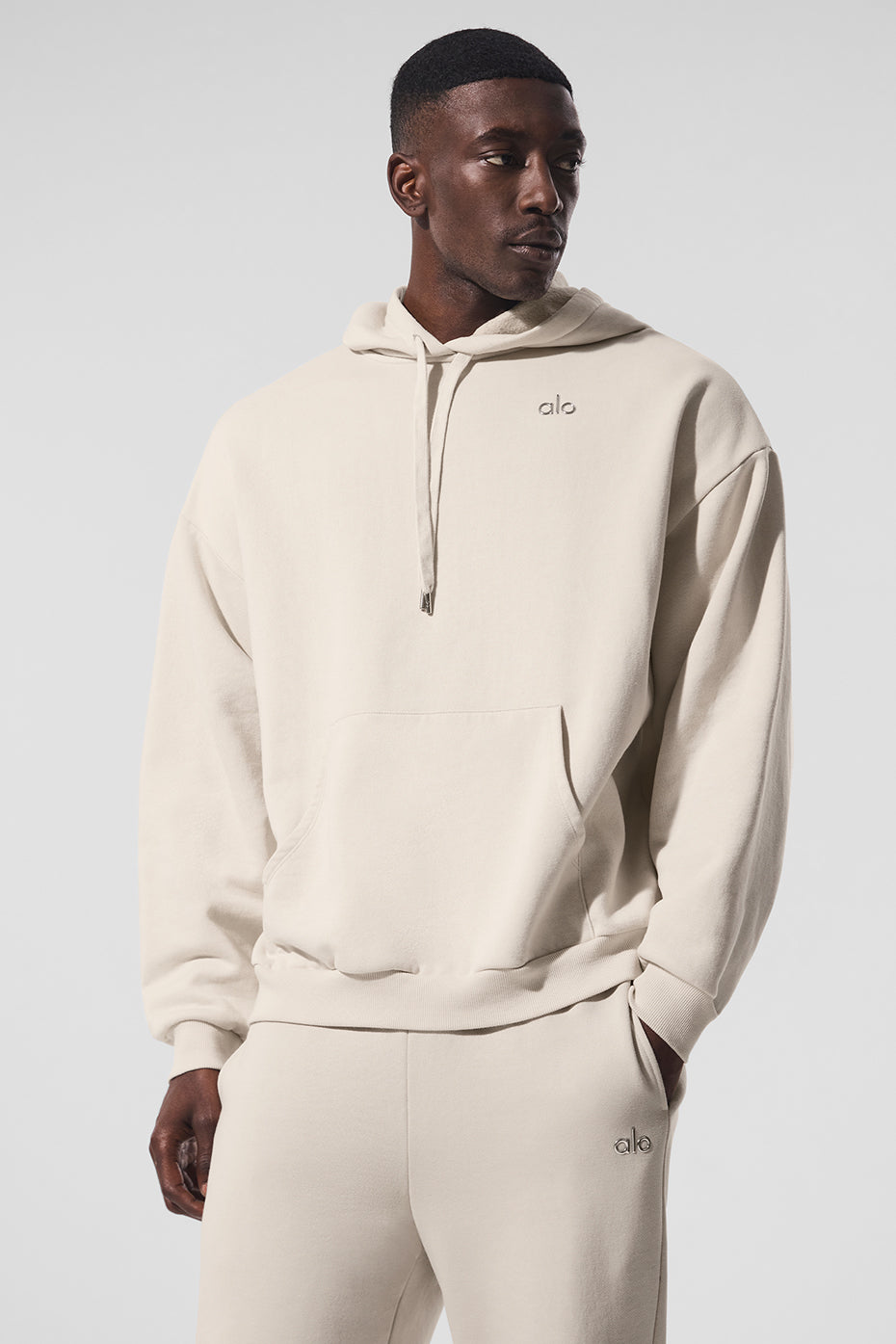 Front view of the parke comfort hoodie in bone color, showcasing its relaxed fit.