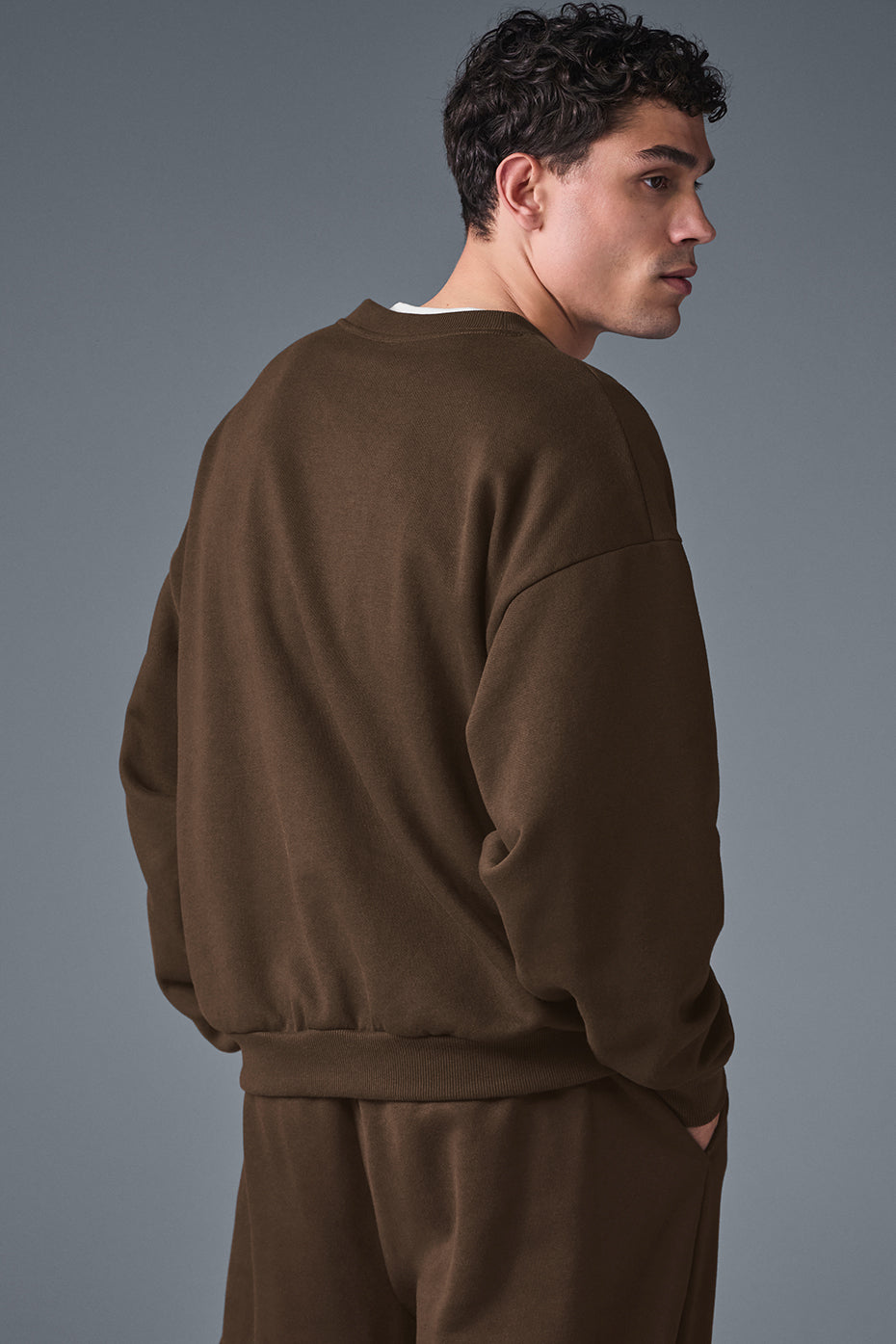 Side profile of pullover crewneck in espresso showing dropped shoulder design