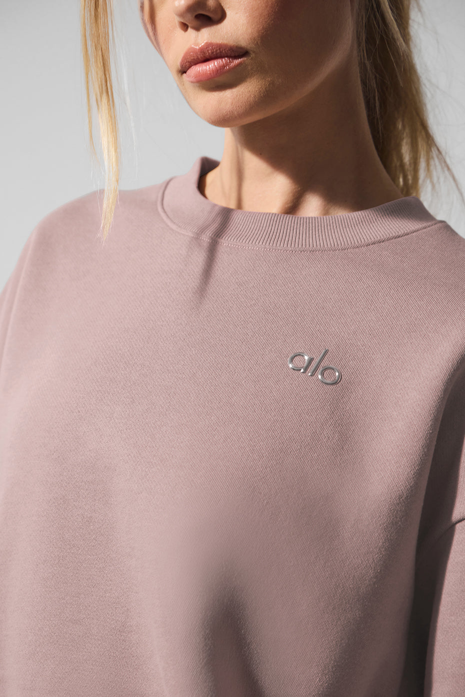 Front view of the taupe womens crewneck pullover, showcasing its dropped-shoulder fit.