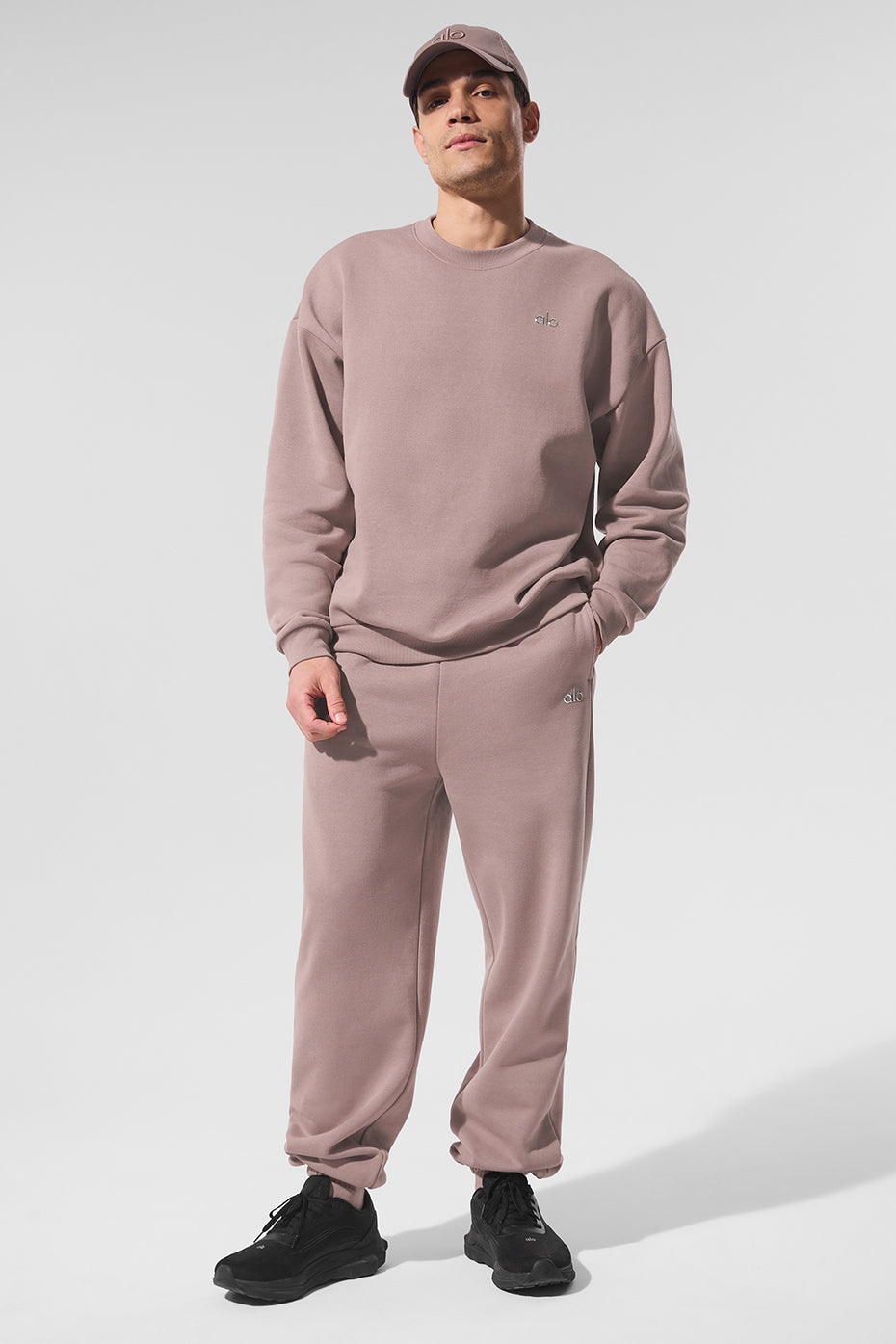Front view of the mens crewneck sweatshirt in taupe with logo detail