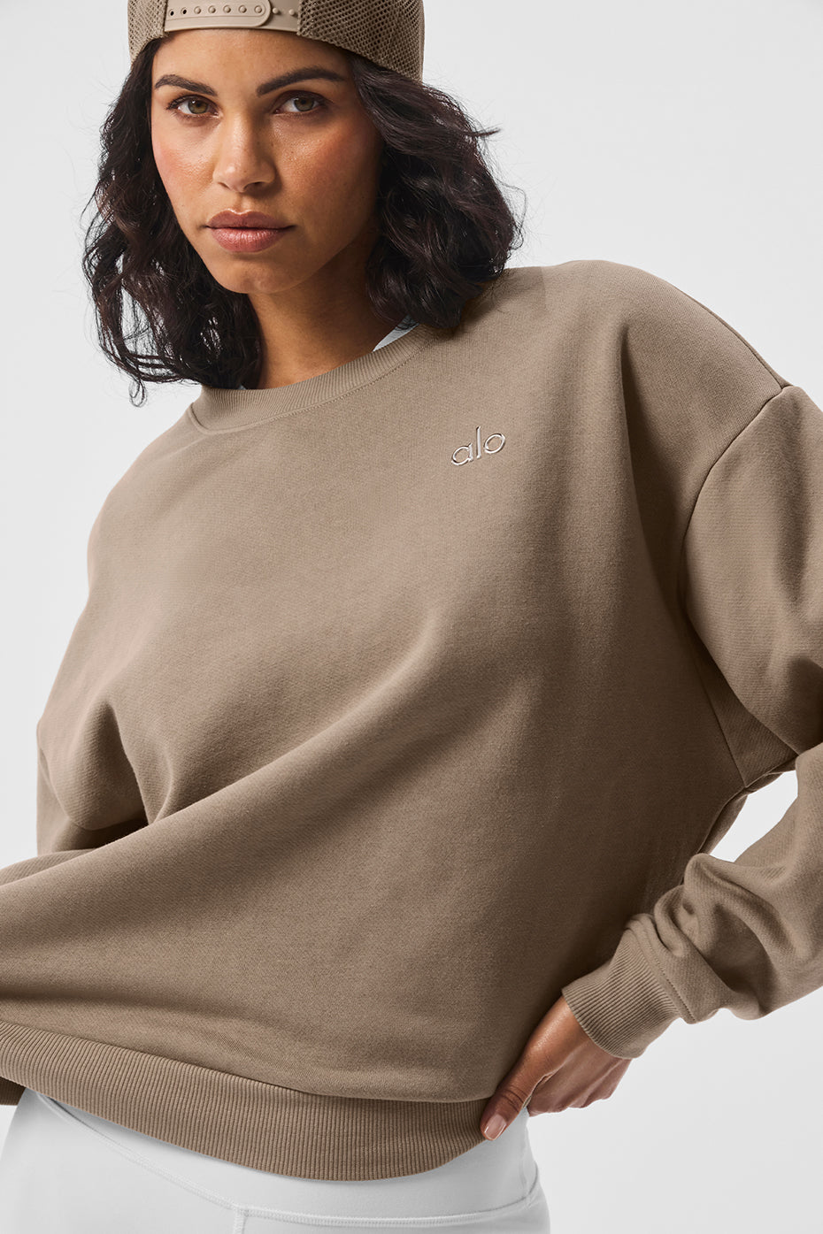 Side view of the Accolade sweatshirt, highlighting the ribbed cuffs and hem.