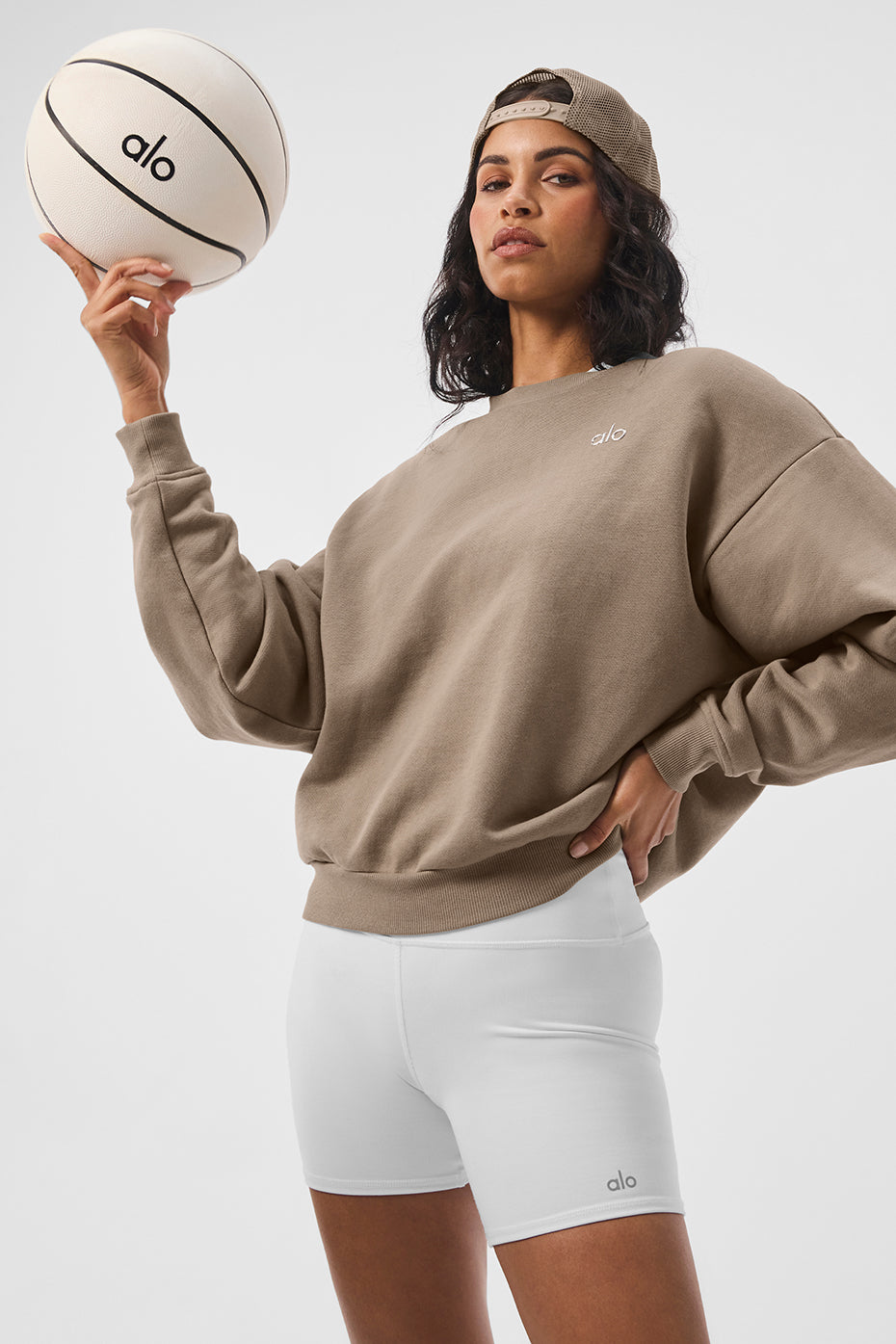 Side view of the Accolade sweatshirt, highlighting the ribbed cuffs and hem.