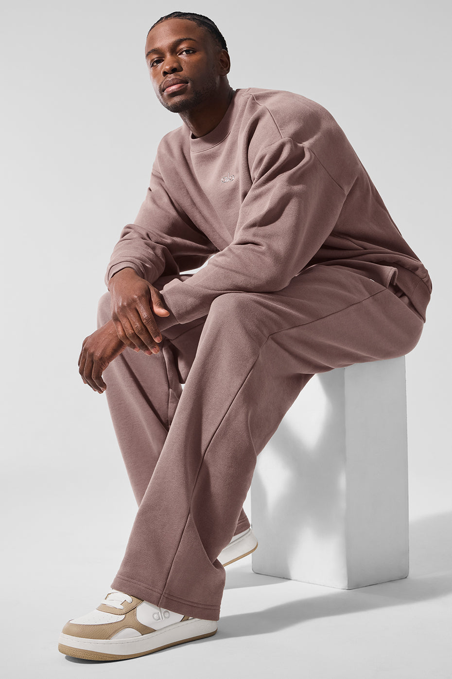 Front view of the Accolade crew neck pullover in mushroom color, showcasing its relaxed fit.
