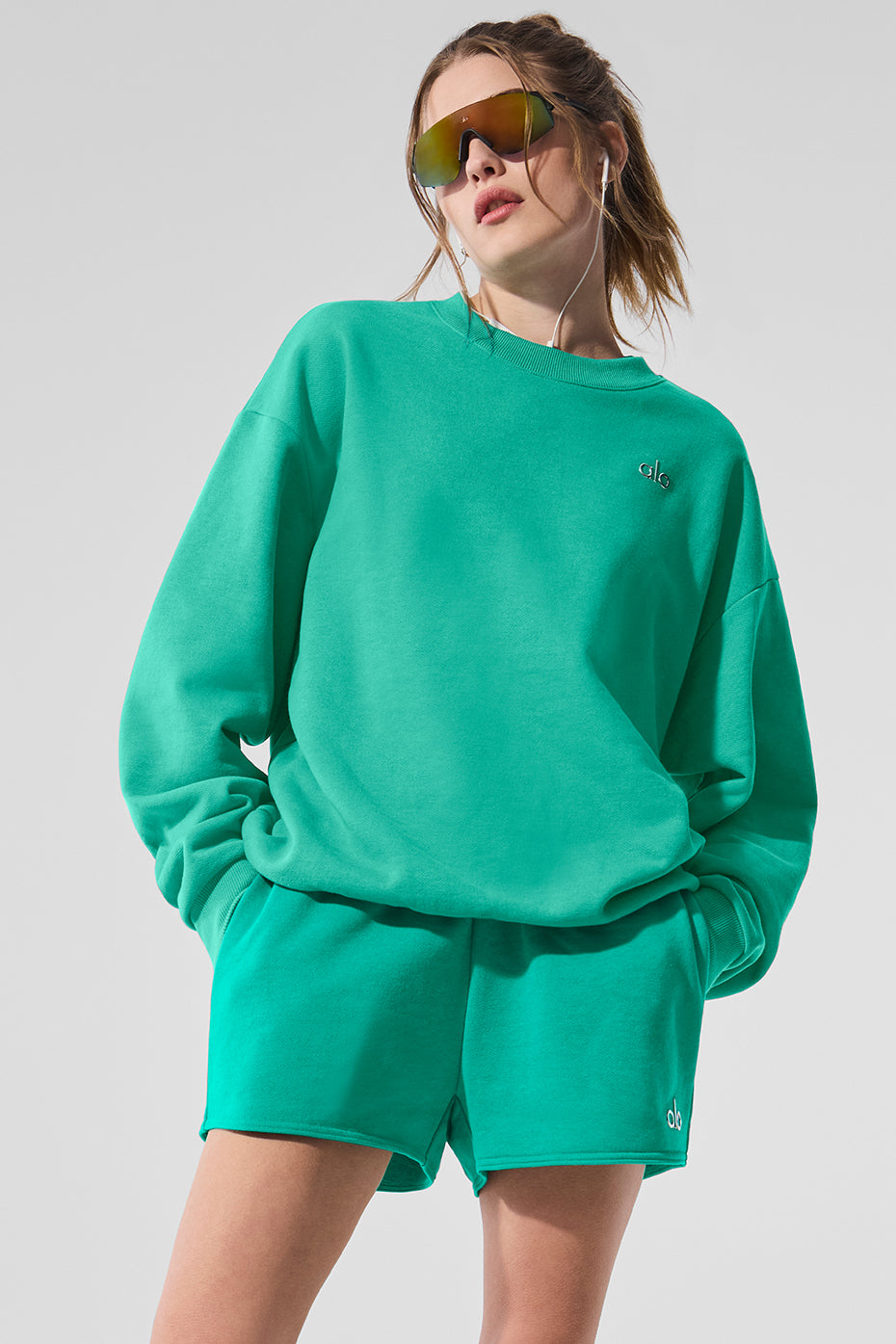 Close-up of the ribbed cuffs and hem of the black crew neck pullover.