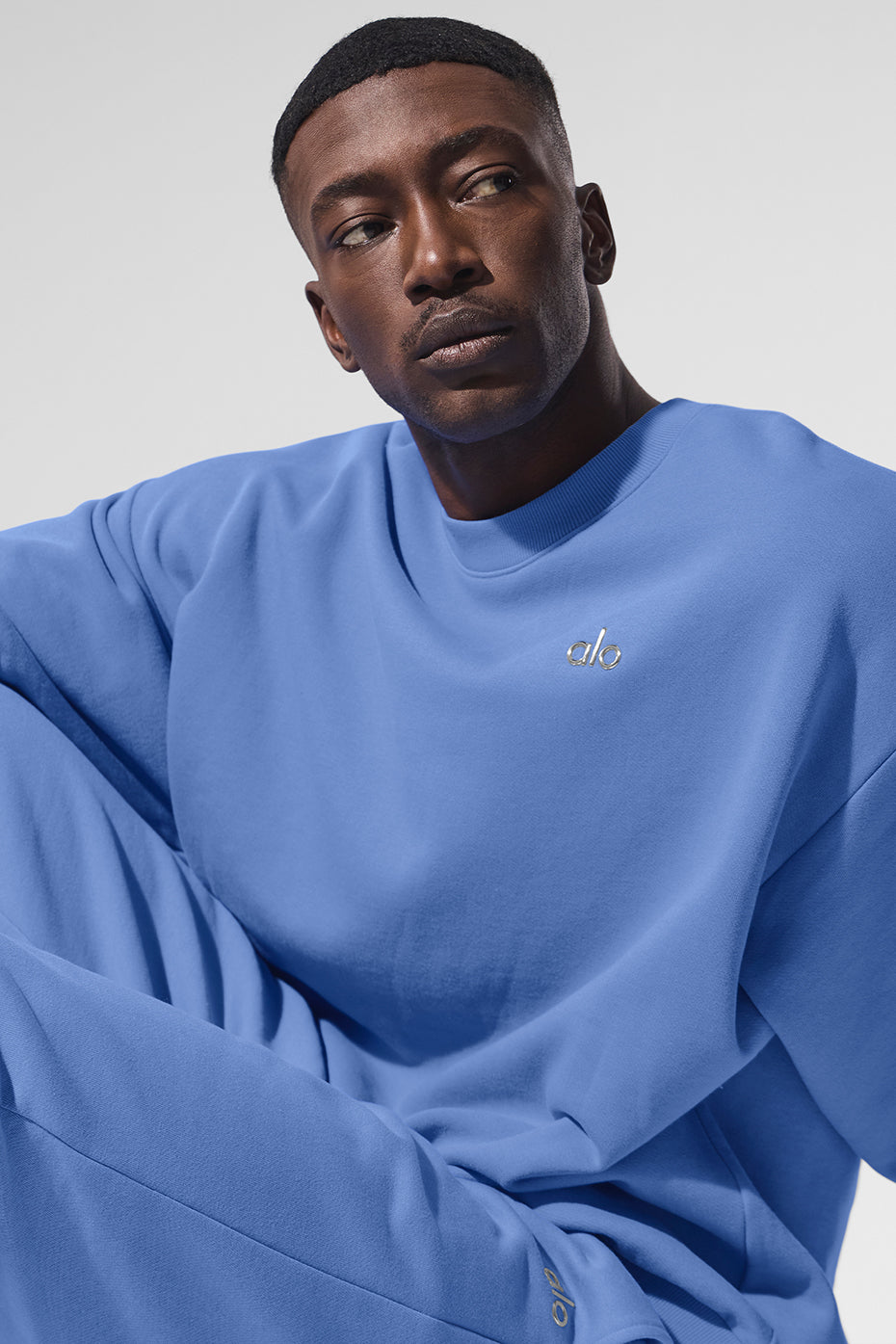 Model showcasing the Accolade crew neck pullover paired with matching sweatpants.