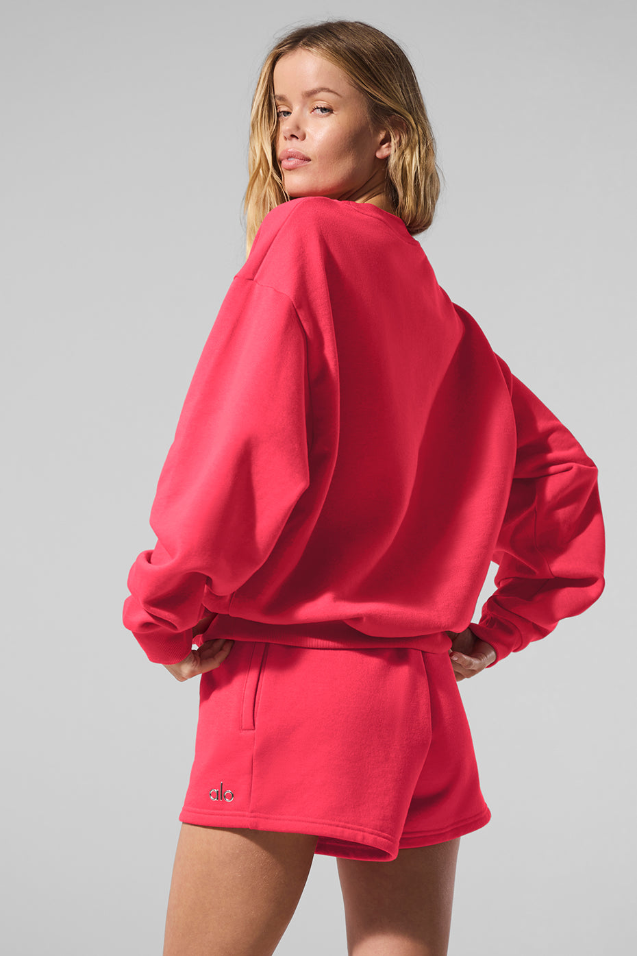 Back view of the black crew neck pullover showcasing its relaxed fit.